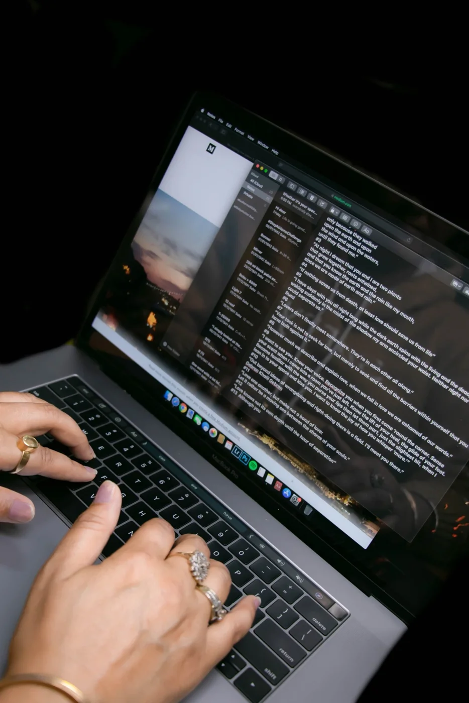 Hands typing an email on a laptop