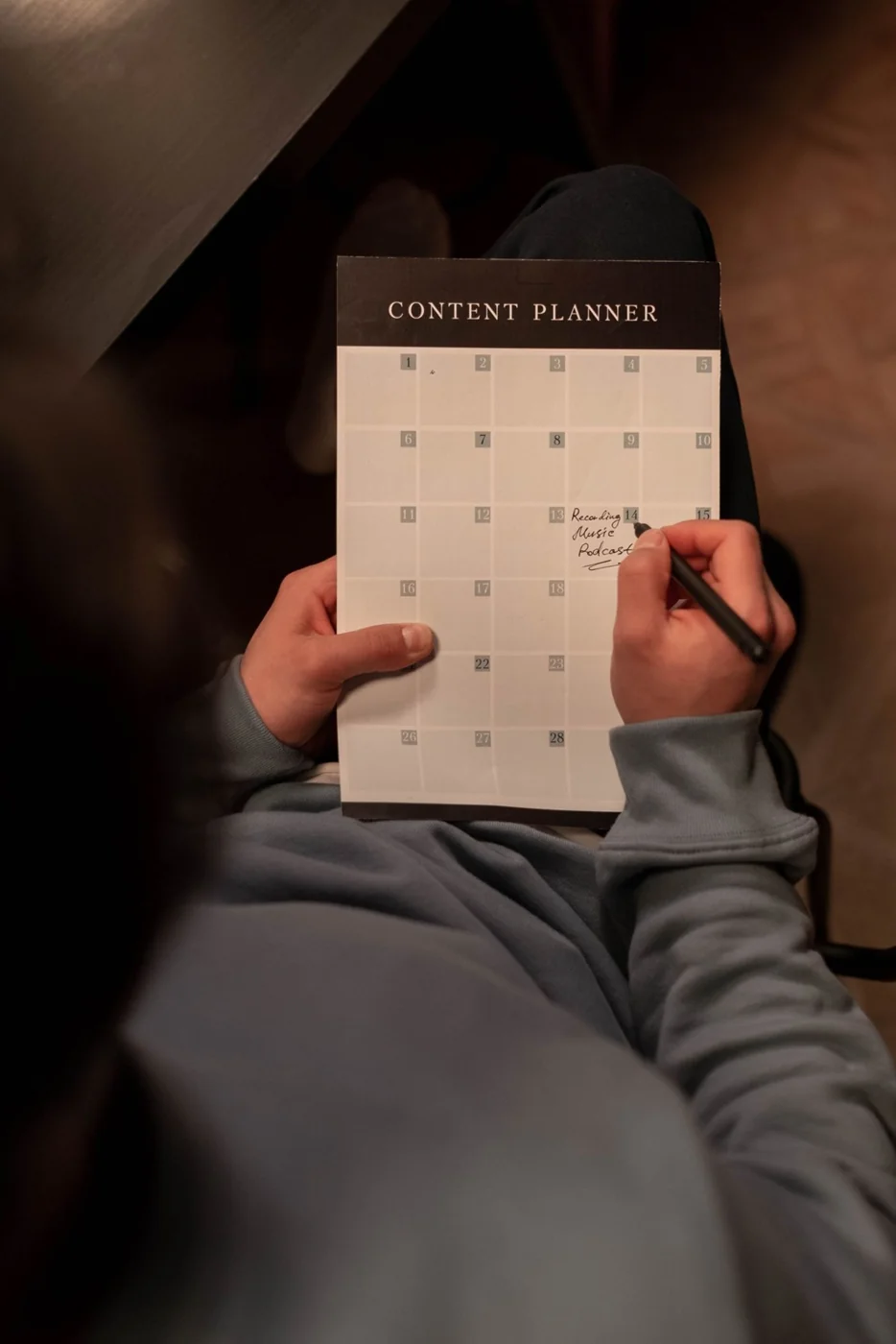 A person organising dates in a content planner