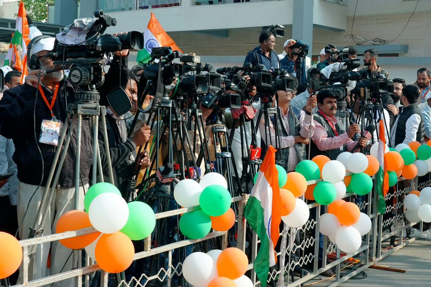 Journalists and camera crews documenting a public event in Ahmedabad, India